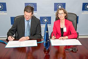 Hilde Hardeman and Pascal Legai sign the  Delegation Agreement