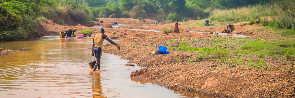 Image of a people looking for diamonds in a river