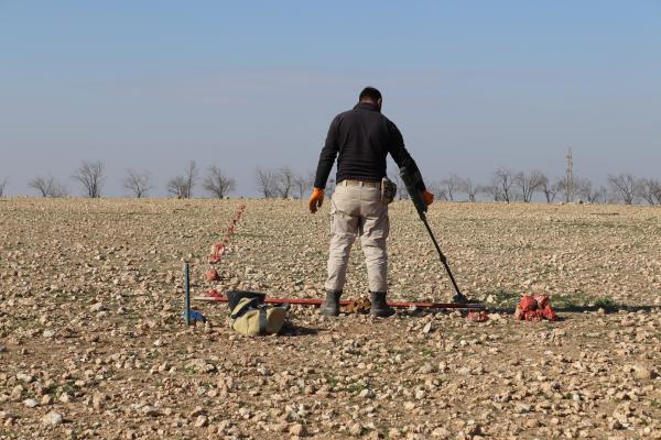 Conducting full manual clearance in a minefield, Syria